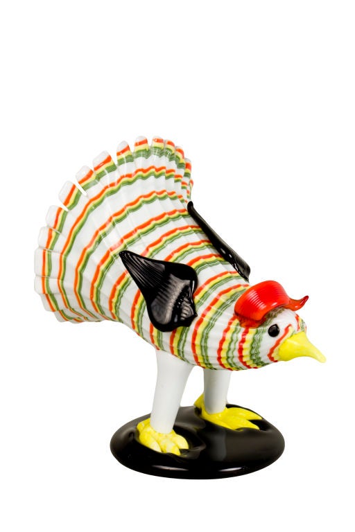 A Pair of Italian Art Glass chickens by, Fulvio Bianconi for Venini GALLO E GALLINA of a rooster and hen with lattimo body and polychrome applications atop a black applied glass base. The tallest measuring 7.25 inches tall.<br />
<br />
A similiar