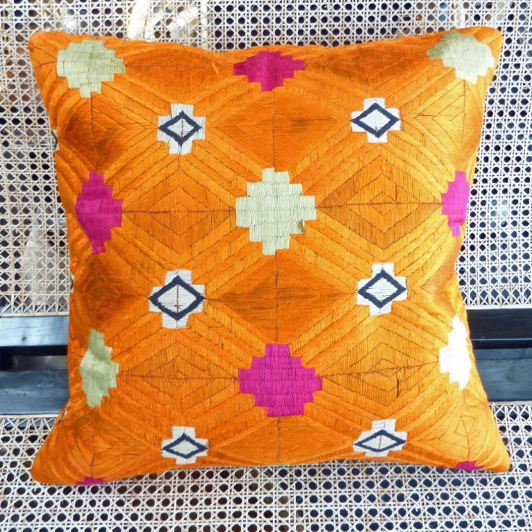 Down filled pillow made from a vintage hand woven phulkari from northern India . Phulkaris were used by a bride to cover their head and body during a traditional marriage ceremony. Base fabric is hand-loomed cotton with heavily embroidered silk