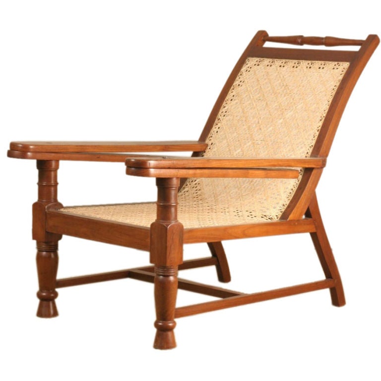 Anglo-Indian Teak Planters Chair with Sliding Footrest Arms