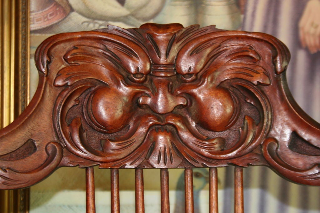 This Steambent Mahogany Chair reflects the Victorian “Grotesque” style that mimicked that of the Italian grottoes. The carved face on the back of the chair is of “maskerones,” or “mask,” that was also quite fashionable in Italian design at this
