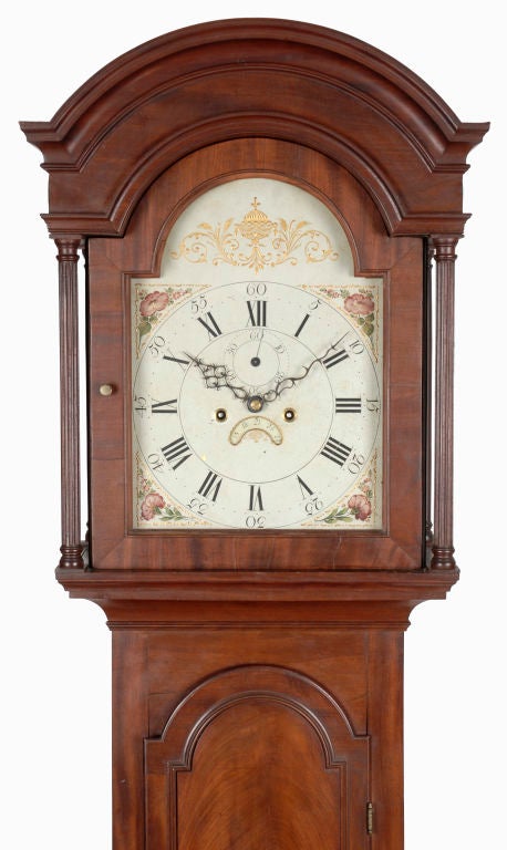 This grandfather clock features wonderfully figured mahogany and a mellow old surface, is in an agreeable small size.  The movement was produced by the rare Newport maker Walter Cornell.  He was born in Portsmouth, Rhode Island in September 1777 and