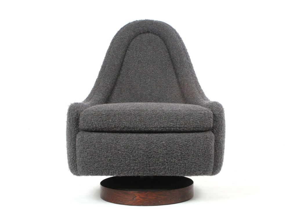 A  low bucket lounge chair on a rosewood disc base with a tilt, rock, and swivel mechanism, price per chair. Designed by Milo Baughman made by Thayer Coggin.

Chairs in image sold. Other can be upholstered to match. or COM.