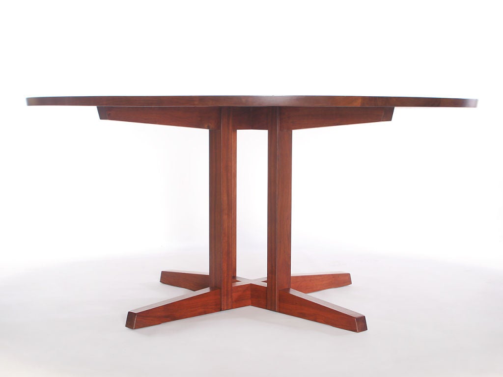 large diameter walnut dining table designed and built by George Nakashima Studio in almost new condition from 1962