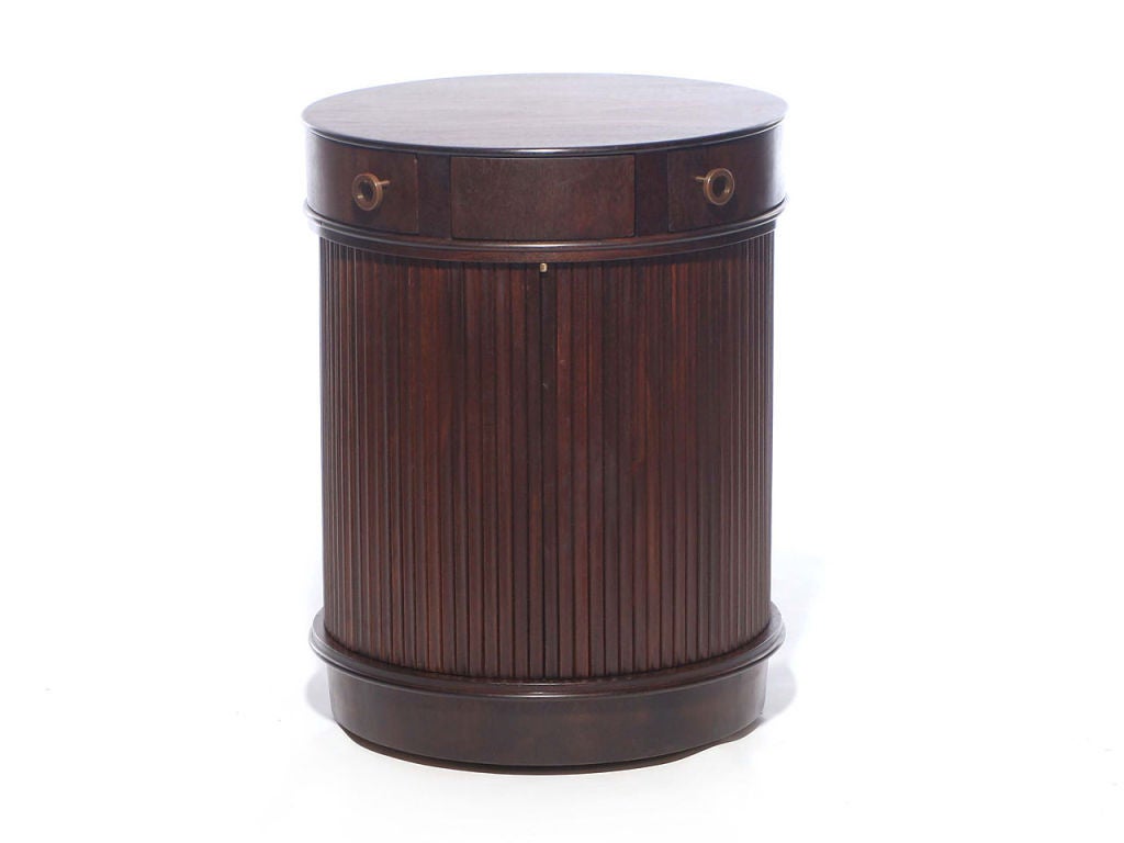 A remarkable end table discreet bar with butterfly hinged top drawers and a tambour cabinet with adjustable shelf.