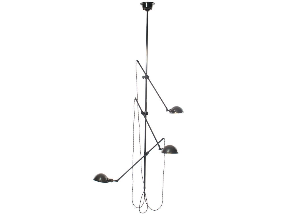 A patinated steel industrial ceiling lamp with a central pole supporting three adjustable arms with dome shades.