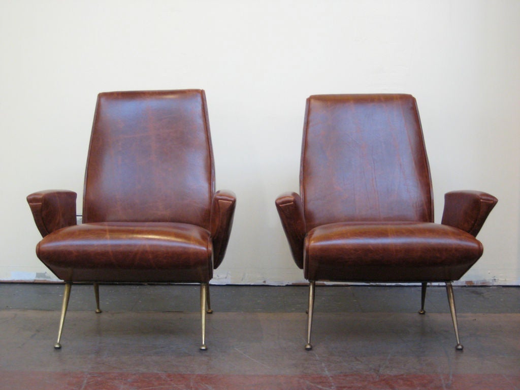 Pair of Italian brown leather armchairs with tapered brass legs