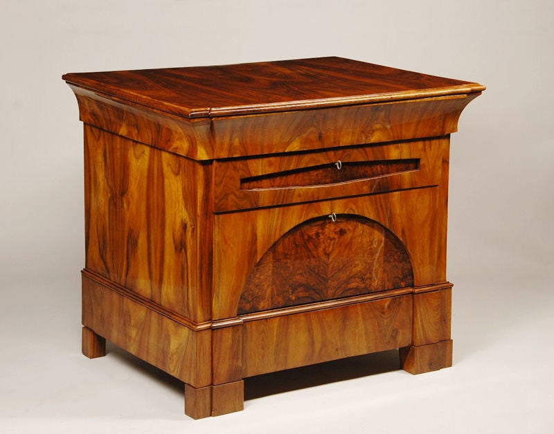 A handsome Biedermeier four-drawer commode with architectural detailing.