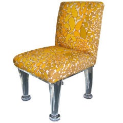 A vintage upholstered Lucite chair