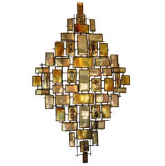 A mid century modern metal wall sculpture