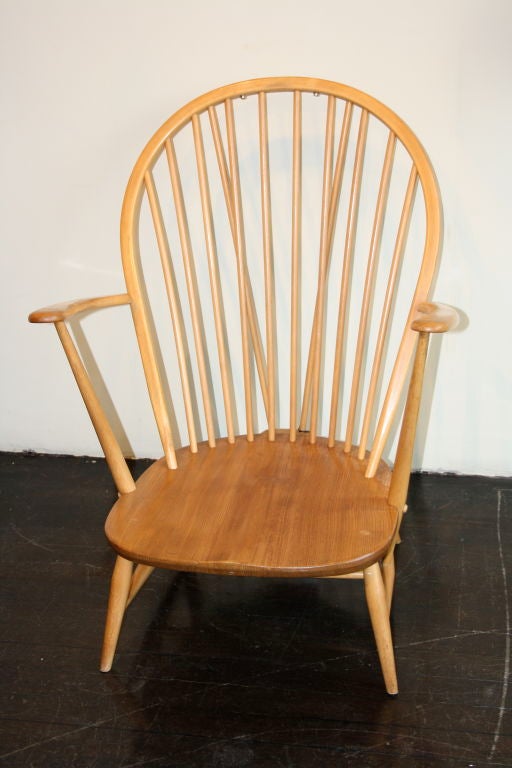 Elm low chair based on the English Windsor Chair. Designed by Lucian Ercolani for his furniture workshop Ercol. Early piece.