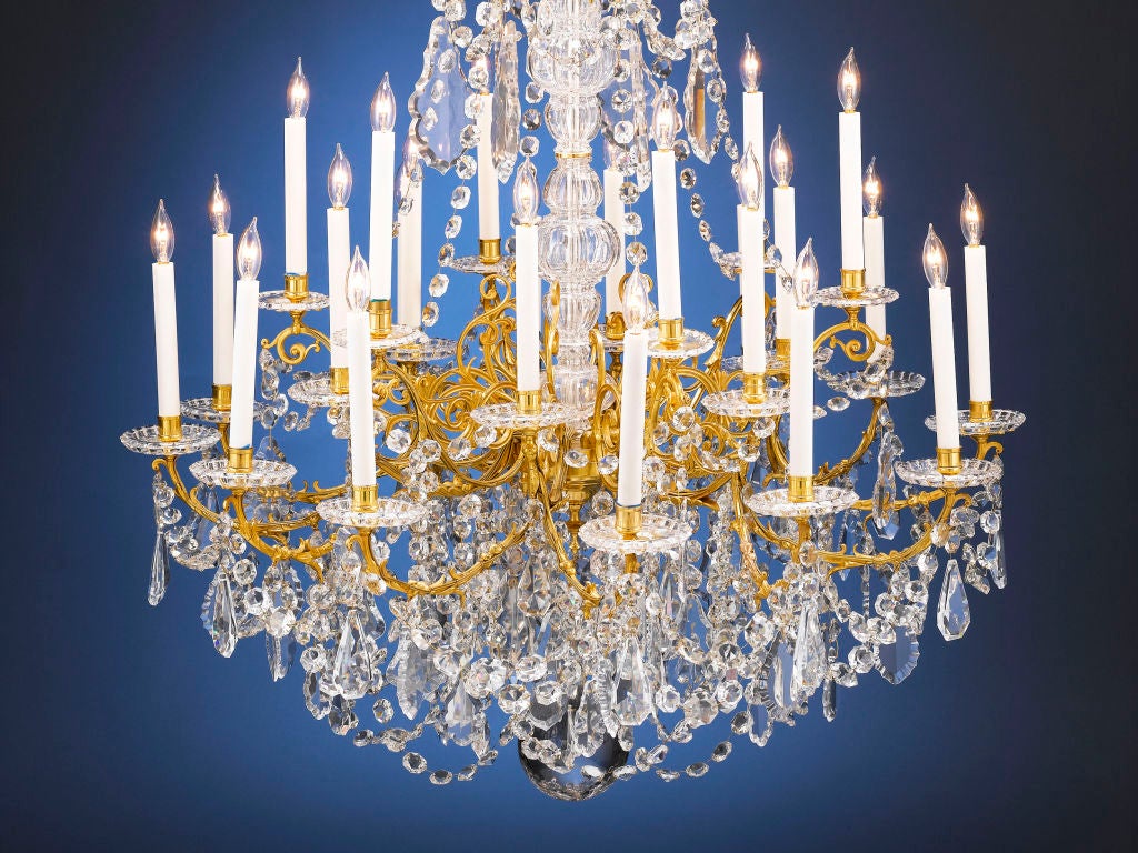 This outstanding crystal and doré bronze chandelier crafted by Baccarat is truly a splendid sight to behold. Of monumental size and opulent design, it bears all the hallmarks of that company’s exceptional style. This stunning 24-light piece is