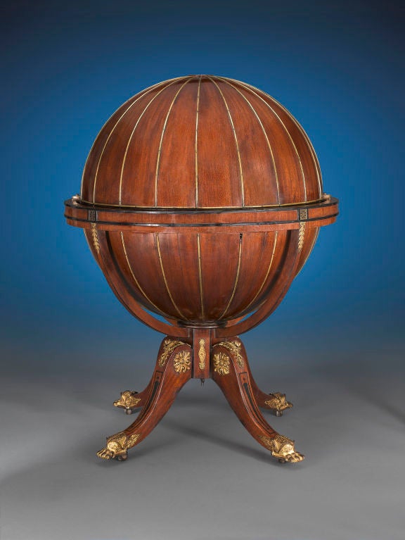 This extremely rare English Regency globe desk was crafted by the highly respected firm of Morgan & Sanders and boasts outstanding design and flawless construction. Morgan & Sanders were producers of top quality furniture of the late Georgian and