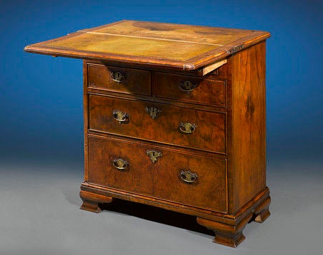 This rare and exquisite 18th-century bachelor’s chest is a stunning example of early 18th-century design. Crafted of sturdy walnut, this elegant chest was made to accommodate close quarters. The piece provides both ample storage, with five graduated