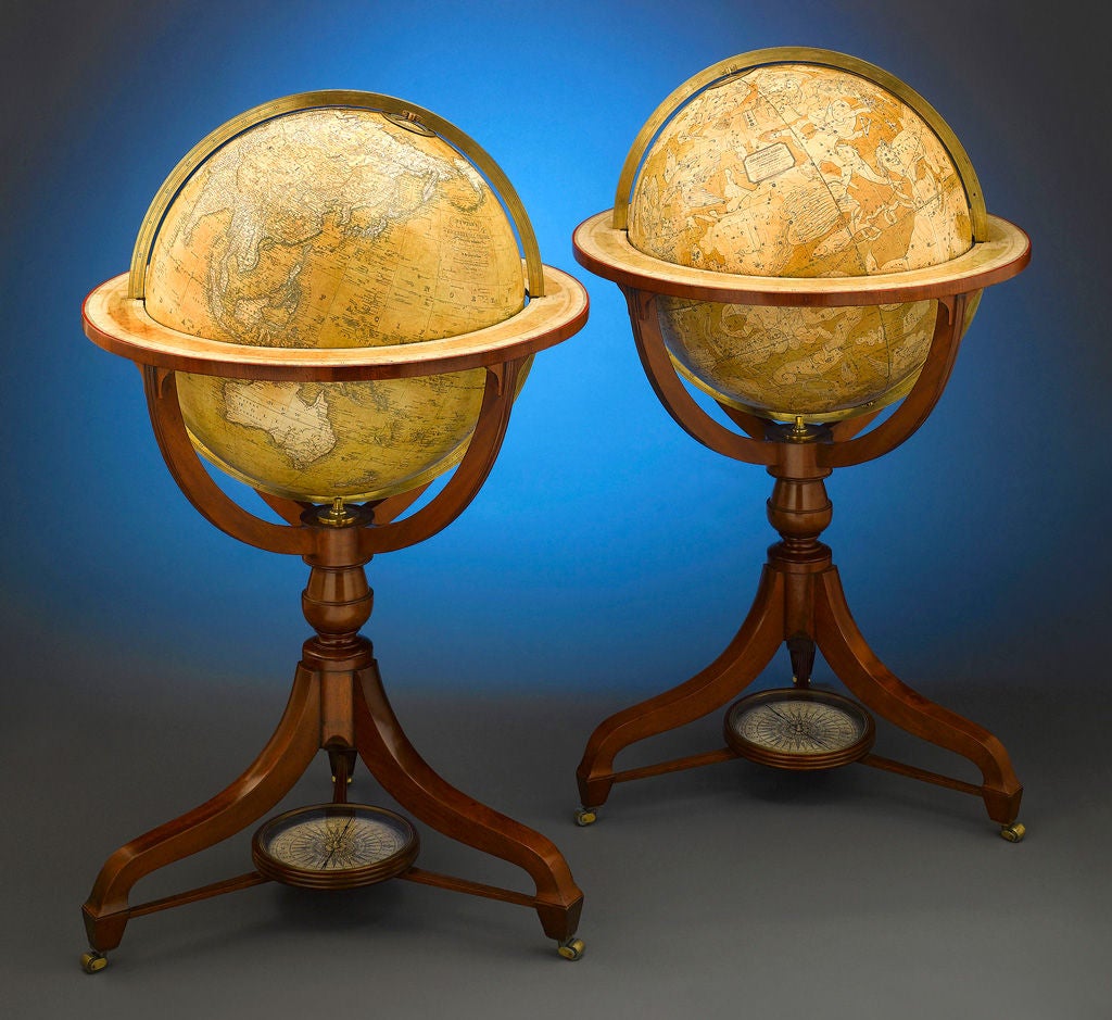 An extremely rare and important pair of 21 inch English globes by renowned cartographers John Newton and Son, one of the most important globe makers of early 19th century England. Representing the terrestrial and celestial landscapes, these spheres