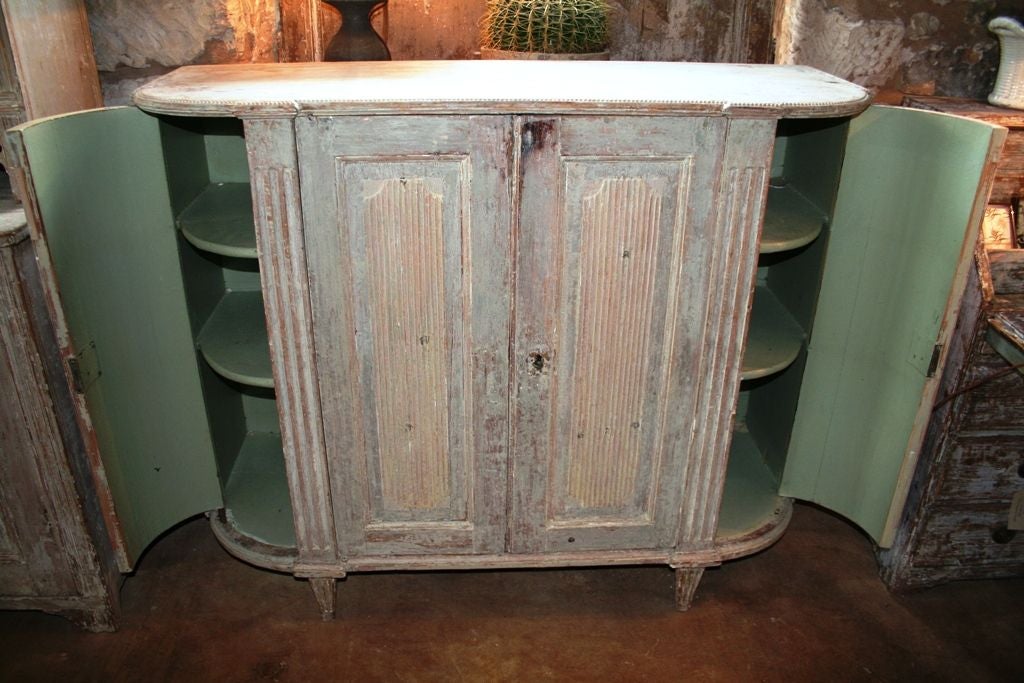 This amazing Gustavian buffet is an elegant attribute to any space. Original paint and unique construction make this piece truley timeless.