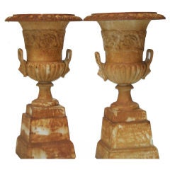 Pair of Urns with Rossette and Lion Ornamentation