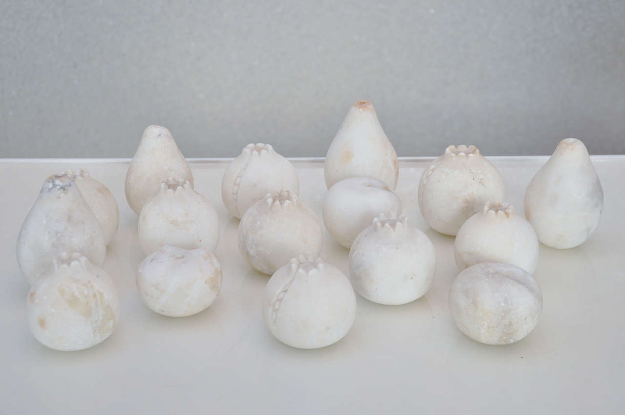 Vintage alabaster fruit in the shapes of pomegranates, pears and peaches.  Sold individually.
Sizes range from 3.5