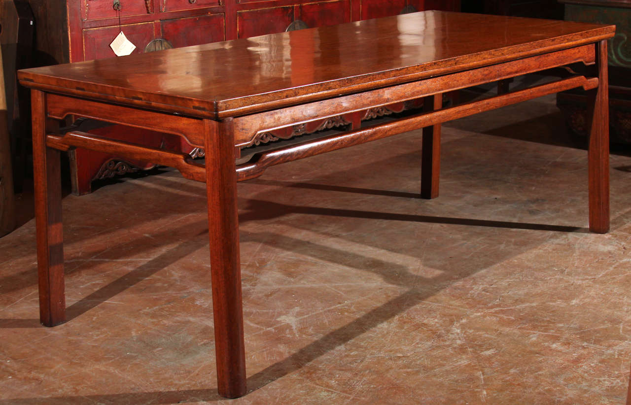 Chinese scholar's painting table. Of rectangular form, the table is constructed of solid Hongmu (rosewood) panel top, slightly tapered legs, and a continuous stretcher butted to the underside of the humpback apron with a beaded edge.
Late 19th