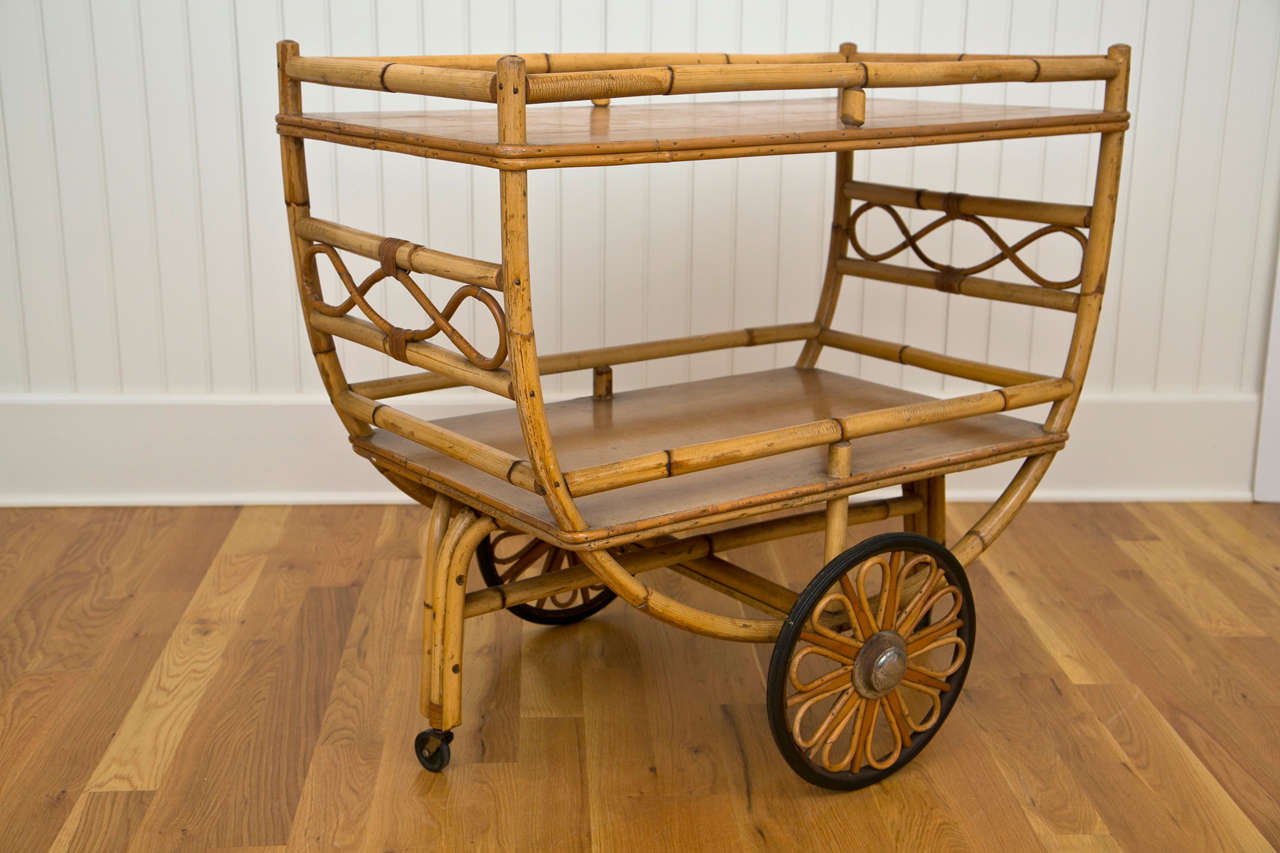 Large rattan serving cart.

Dimensions: 36.5 long x 20.5 wide x 32.5 tall.

Outside width including wheel hubs is 27 inches.
Tray height is 30 inches.