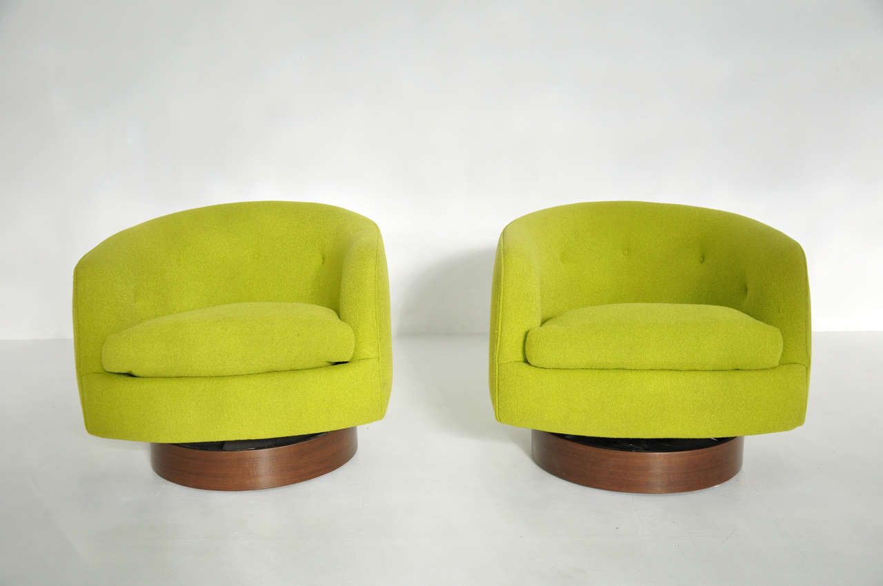 Milo Baughman swivel lounge chairs.  Chairs swivel and tilt/rock. Bases have been fully restored.  Original green upholstery.