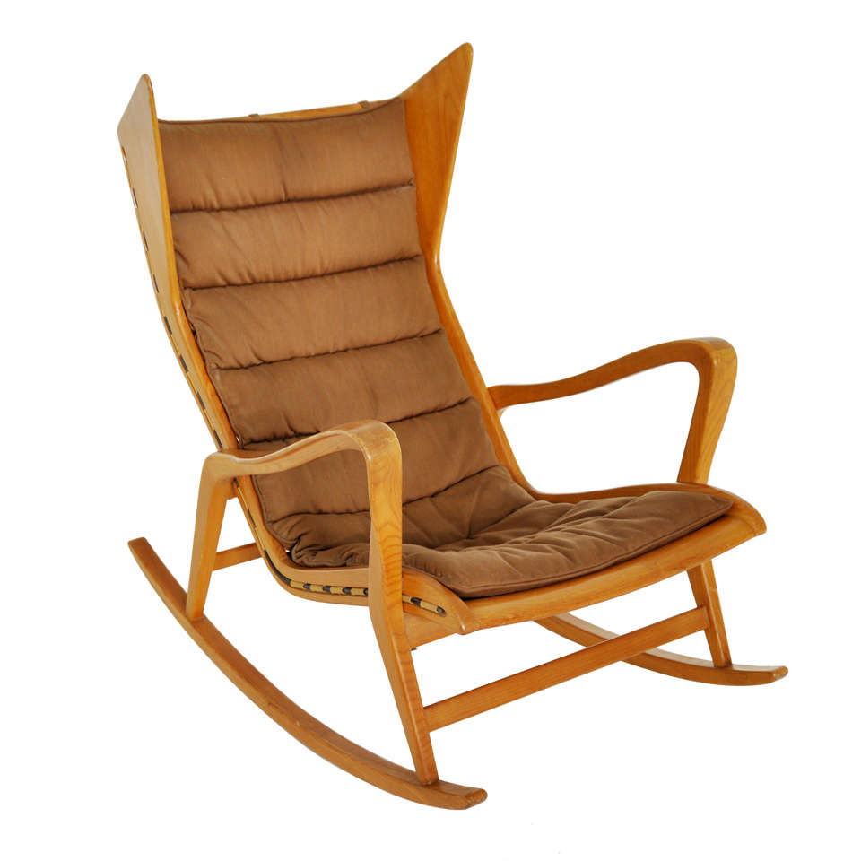 Rocking chair designed by Gio Ponti for Cassina.  Sculptural form frame with flared backrest.  All original collectors piece.