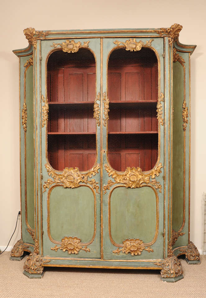 Very nice 18th.Century Italien cupboard, painted green with golden accents.
The doors with wire netting.