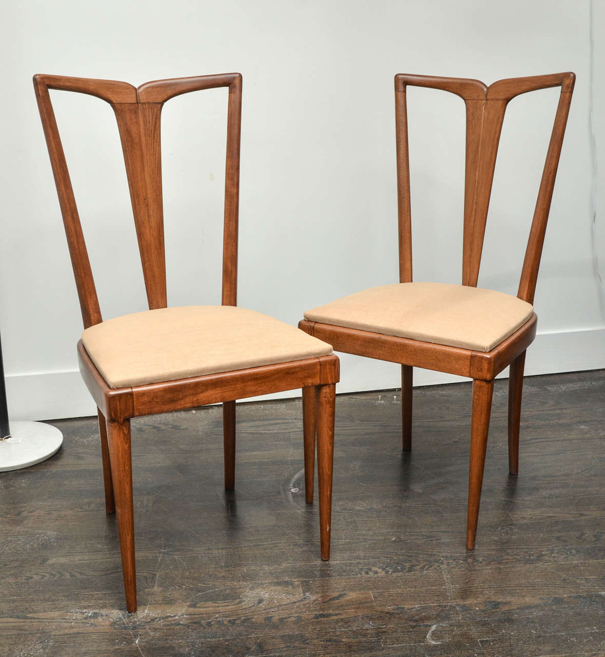 Set of eight dining chairs by Osvaldo Borsani.
Fully restored.