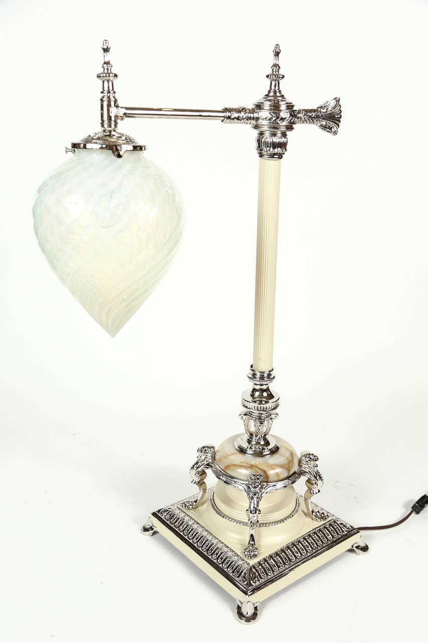 Newly silver plated iron and marble lamp with Murano glass globe and swivel arm.
