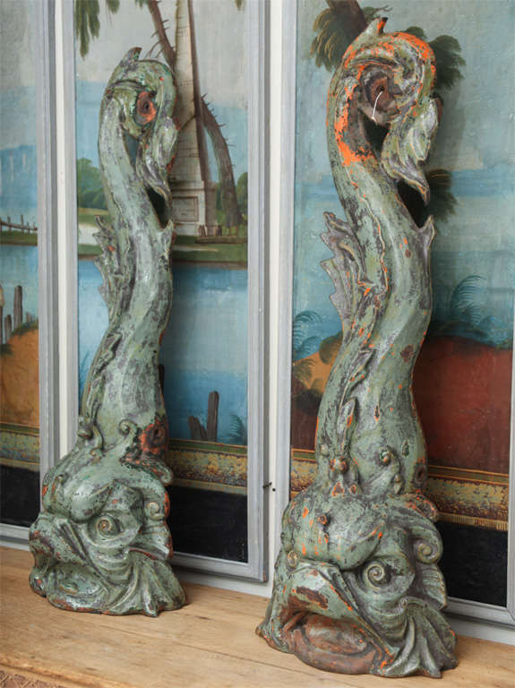 A pair of Frenc green painted cast iron dolphins.