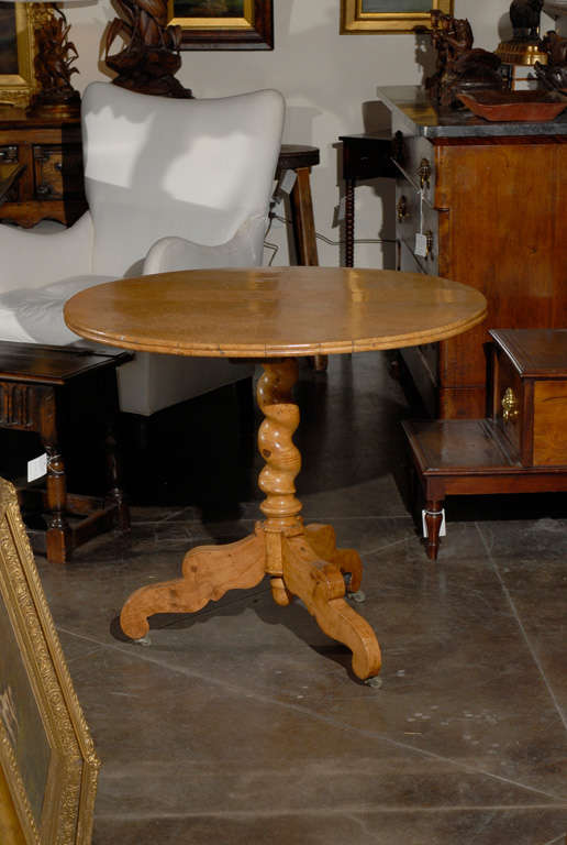 19 th.c. Round Biedermeier table with barley twist pedestal base on castors.