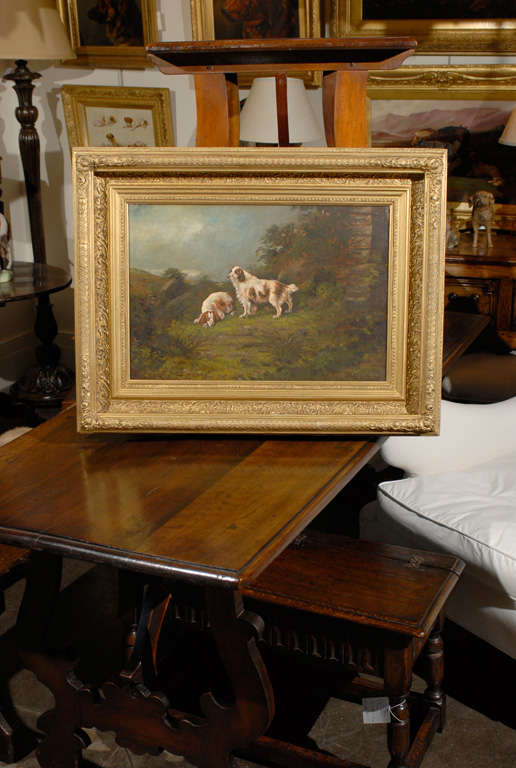 A late 19th century oil painting of sporting dogs displayed in a carved and molded gilt frame, signed by the Scottish painter Peter Graham (1836–1921) renowned for his landscape and animal paintings with one piece exhibited at the National Gallery