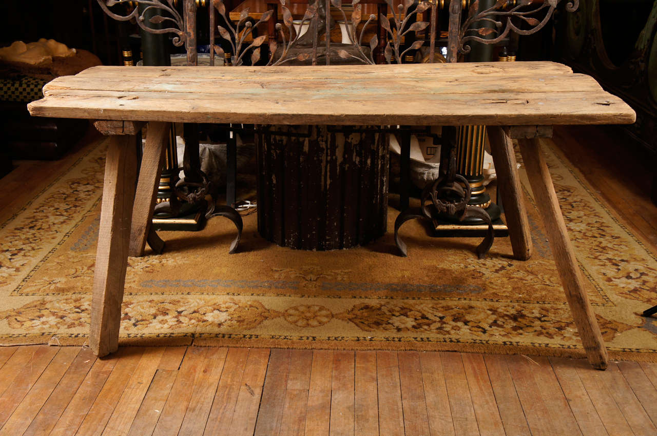 This rustic work purpose table made in pine was found in the New Lebanon area of Upstate New York. Used only during hog butchering time, mostly in early fall, the table was designed to come apart after its use and be stowed away. The area, a Shaker