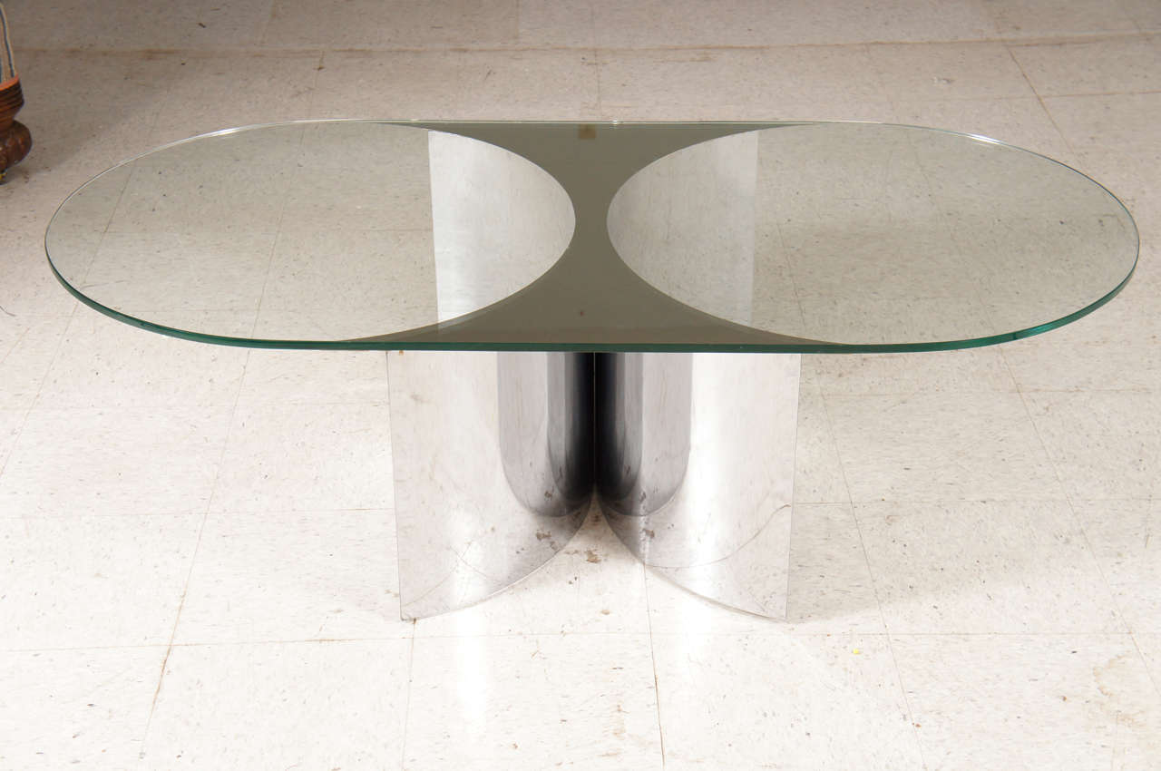 This very cool coffee table seems part Studio 54 and part Cocaine line party fantasy. I can almost feel the beat of the music and see the disco lights flashing. Made from simple geometric elements the table consists of a base of mirror polished