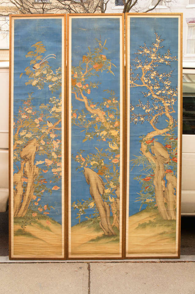 This very tall set of painted panels created in China in the late 19th or early 20th century are delicate and refined. The original scroll style paintings are now formatted within new frames with a dark gold bronze leaf finish but retaining the old