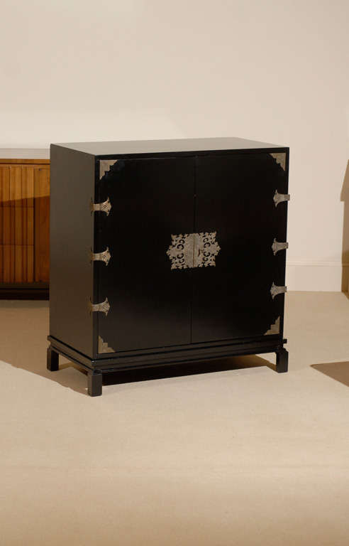 Beautiful John Stuart Cabinet, restored in black lacquer. Asian influence with gorgeous hardware.Excellent condition.TOM ROBINSON MODERN at TRAVIS & COMPANY