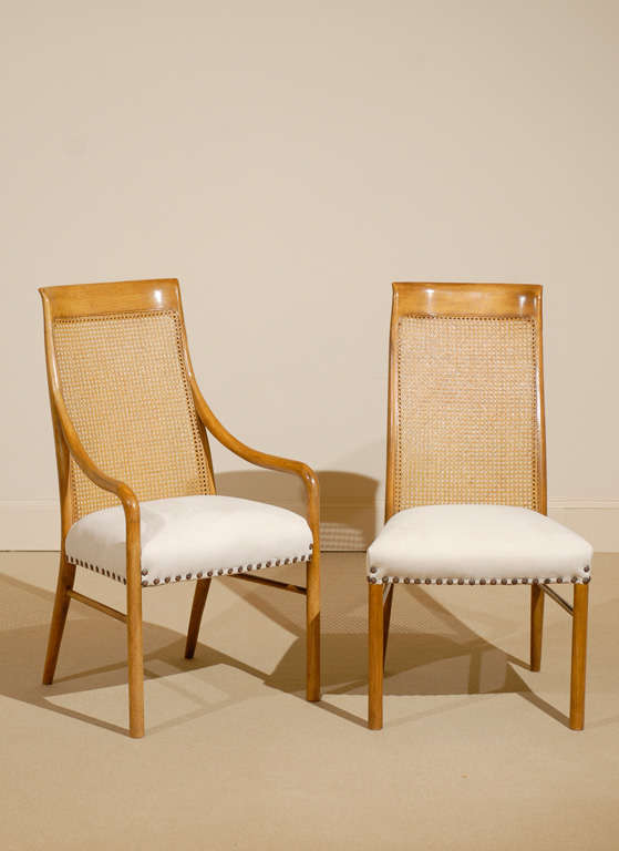 A great set of six (6) cane high back dining chairs by Drexel. The set includes two (2) host and four (4) side chairs, circa 1970. Excellent condition with new upholstery. The price noted is for the set.