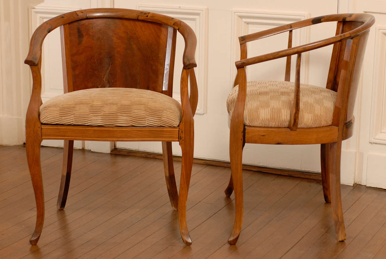 These magnificent armchairs are shipped as professionally photographed and described in the listing narrative: Meticulously professionally restored and installation ready. Expert custom upholstery service is available.

Stunning pair of burl walnut