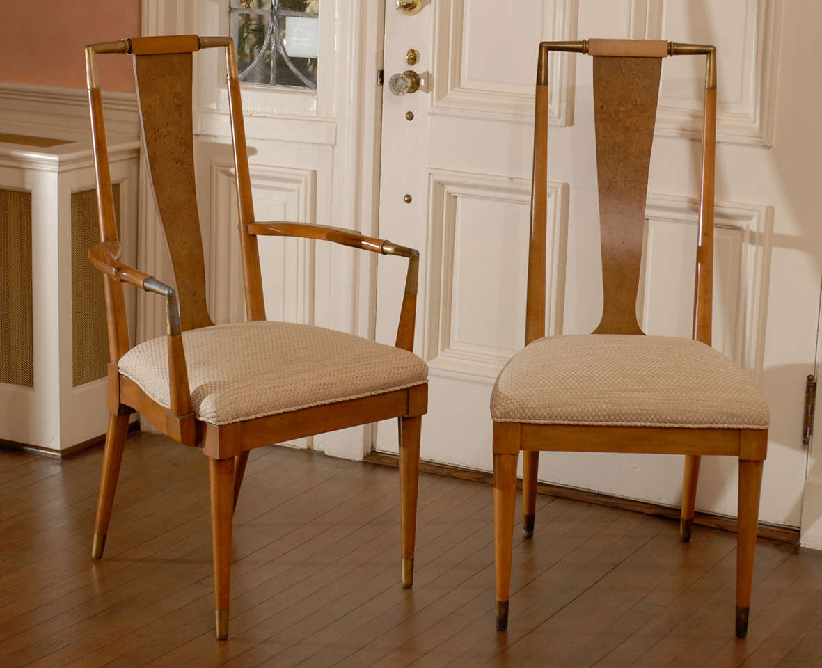 Wonderful set of eight (8) Bert England for Johnson Furniture Co. dining chairs. Reupholstered, six (6) side chairs and two (2) host chairs. Weathered cherry with brass accents.Beautiful vintage condition, great patina. Dining table available from