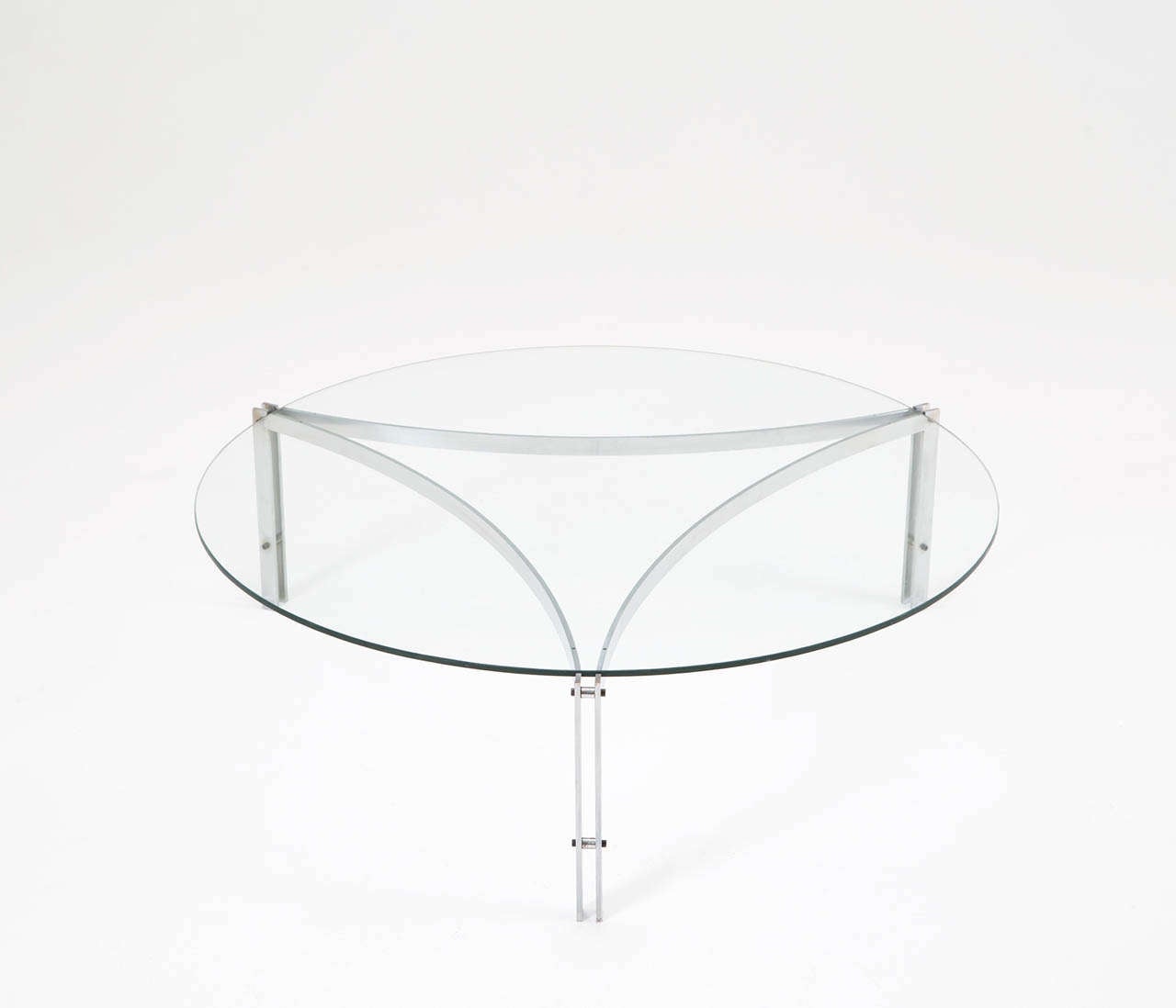 Round coffee table in glass and stainless steel, Denmark 1970s. 
Designed in the style of Fabricius and Kastholm. 
