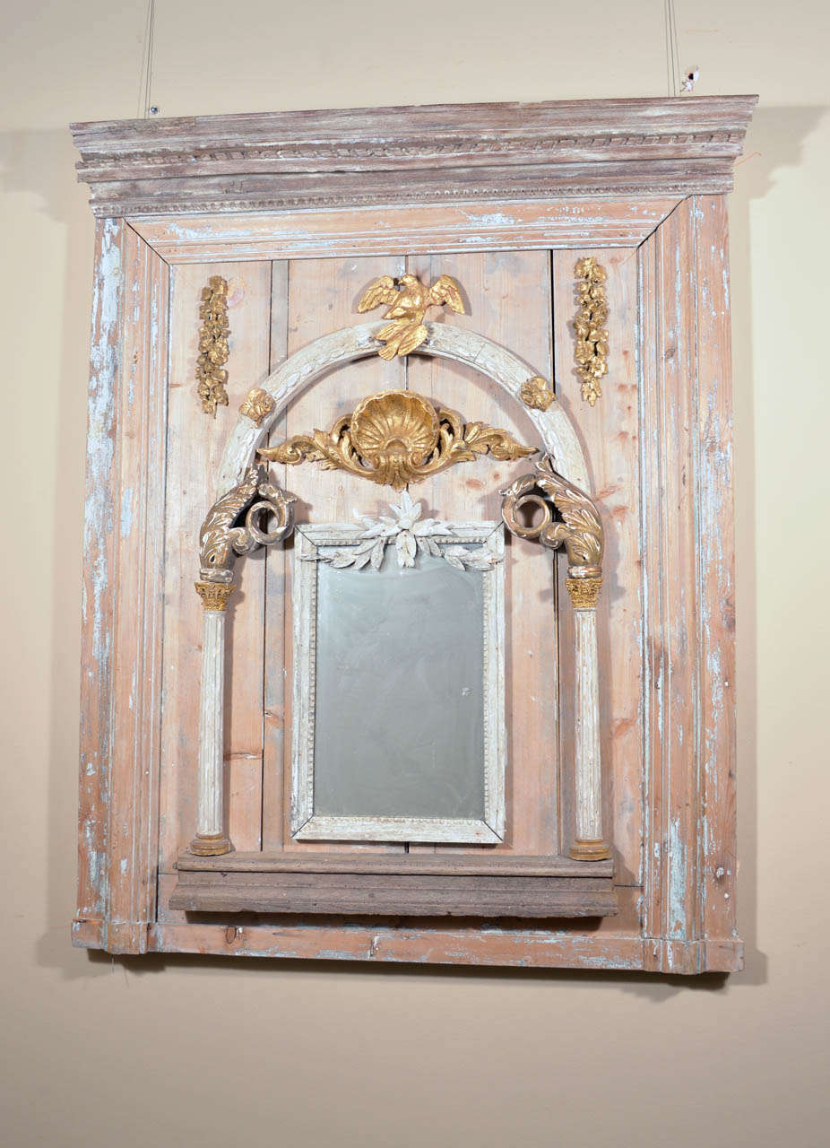 This incredible Italian Trumeau is comprised of 18th & 19th century architectural elements. Within its' make up you can see Neoclassical, Baroque, Rococo & Empire elements. It still has its original hand painted patinas, gilding and glass. Sure to