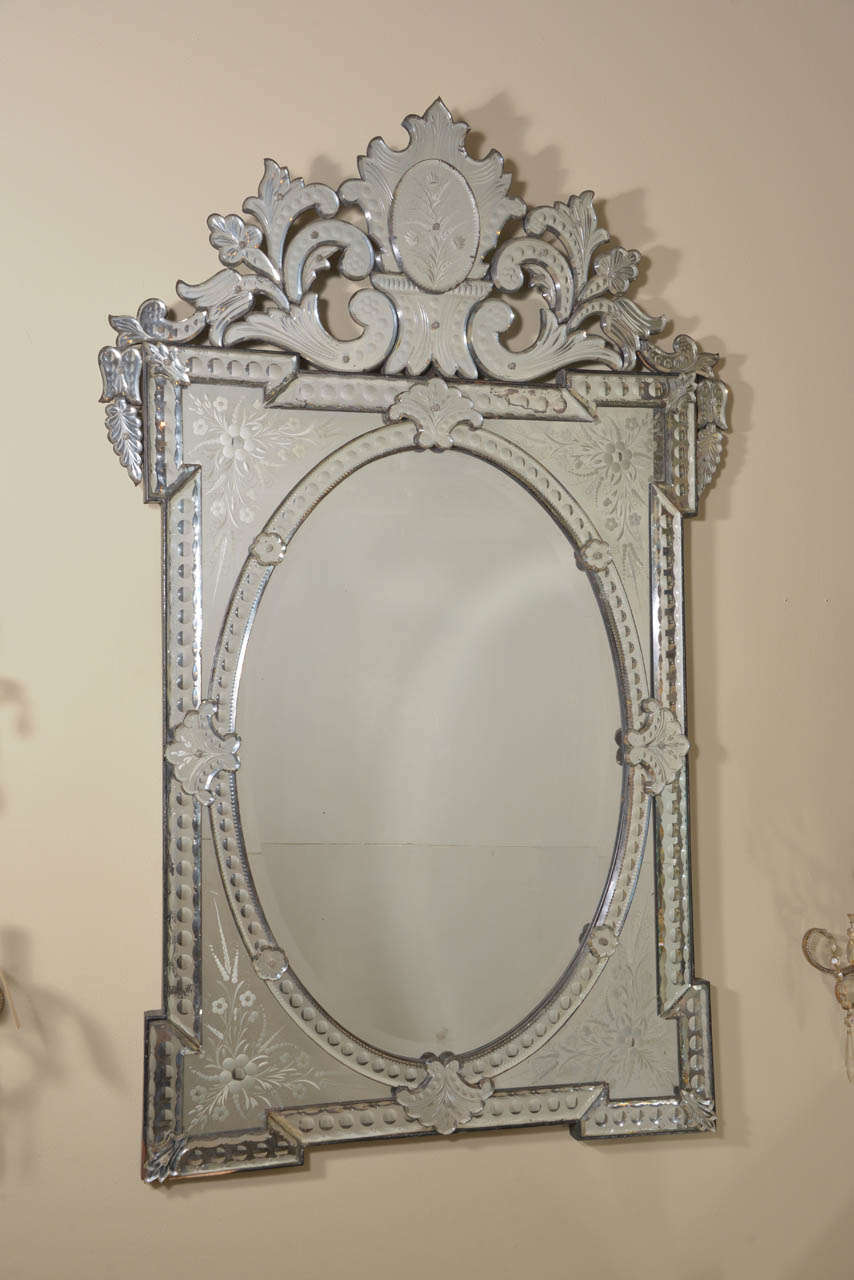 19th century, Napoleon III Venetian mirror. This spectacular piece still has all of its original mirrored glass pieces! It has gorgeous etched and beveled detailing. This mirror will make any room in your home sparkle with old world elegance and
