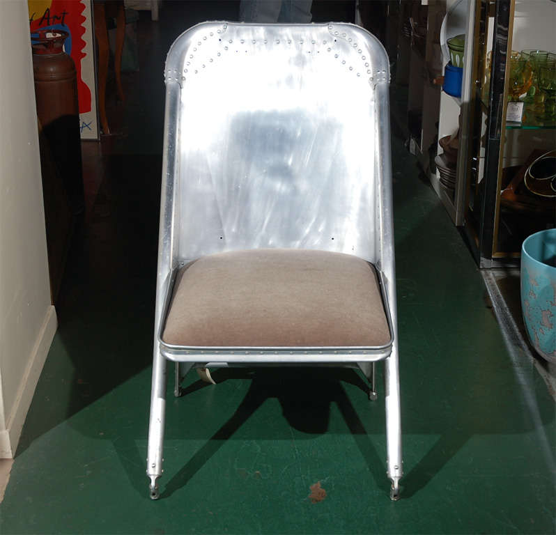 How many people have an aluminum airplane seat chair in their house? This is a very cool statement chair--perfect for the industrial look that is so hot right now. Lightweight but sturdy, comfortable, and right for a lot of spaces. Pulled right off