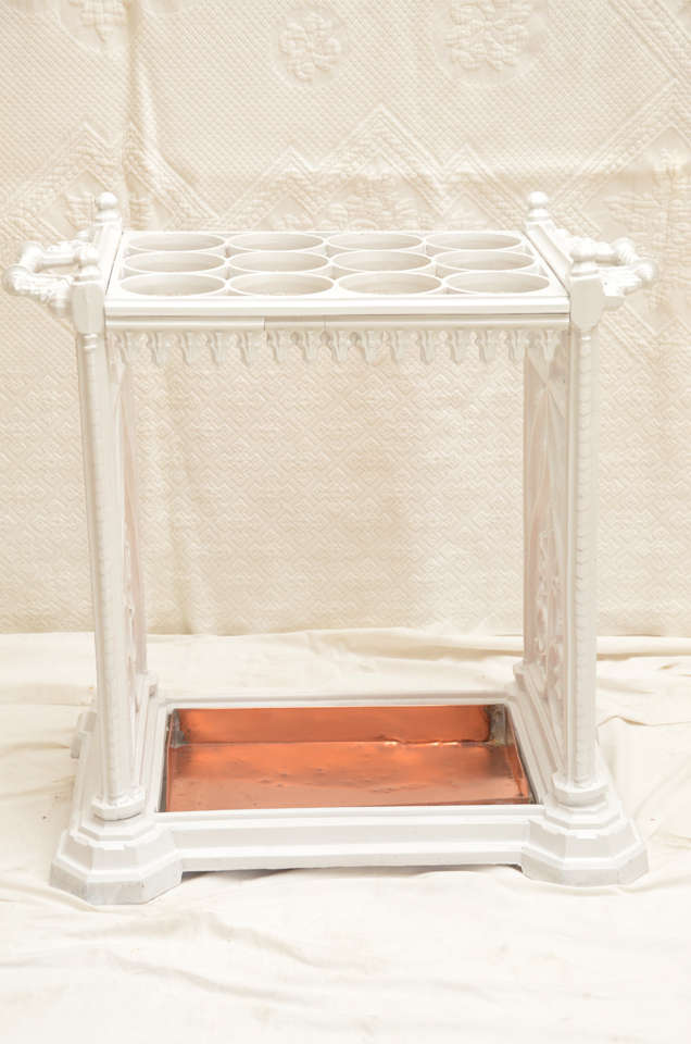 BEAUTIFULLY CAST & HIGHLY DECORATIVE CAST IRON UMBRELLA STAND OF RECTANGULAR FORM WITH 12 APERTURES --LATER COPPER LIFT OUT DRIP TRAY-- END STANDARDS STAMPED W/ REG. KITE NO. 128264 NO.21--C B DALE--APPEARS IN COAL BROOK DALE CASTING CATALOGUE OF