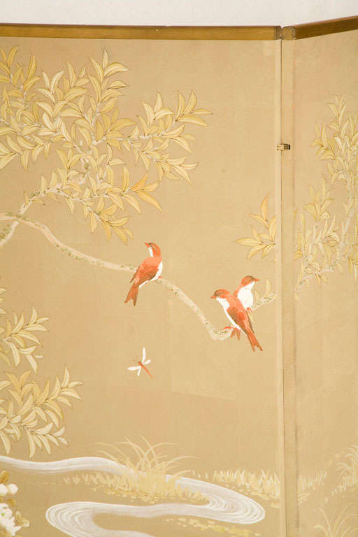 This beautiful three-panel folding screen hand-painted on tea paper was executed by American artist Robert Crowder.  Depicting whimsical birds in flight and ones perched on a tree branch next to a stream of flowing water is quite stunning.  Signed