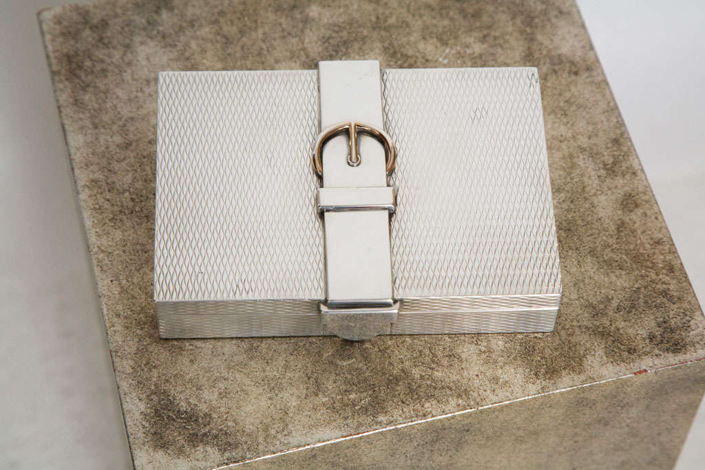 A rare and impressive sterling silver belt strapped box by Hermes.  This ultra chic box features a gold washed buckle and interior with original hallmarks and is stamped Hermes on the underside.