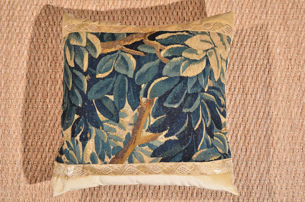 Beautiful 18th century tapestry depicting a tree with leaves that are various shades of teal. This pillow is backed with neutral silk velvet and trimmed with antique champagne gallon.