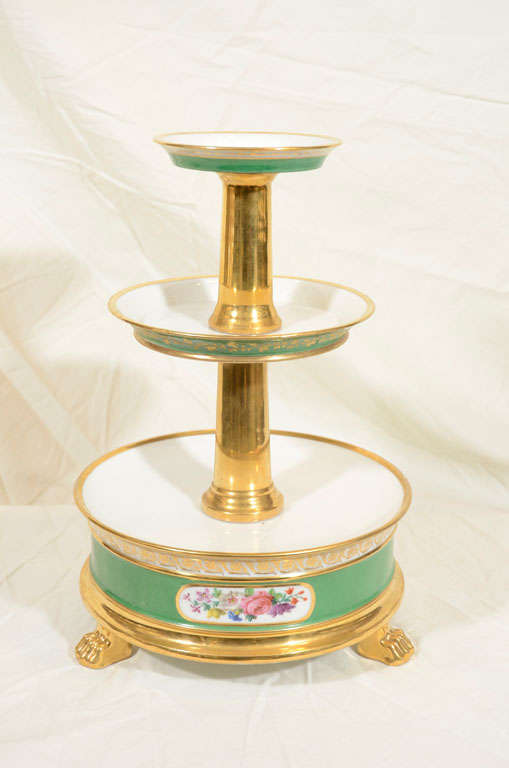 A pair of Feuillet cake stands with bouquets of flowers in cartouches on a French green ground. Founded in 1820 on the Rue de la Paix ParisFeuillet became one of the leading Old Paris ateliers. Feuillet porcelain was bought from several  porcelain