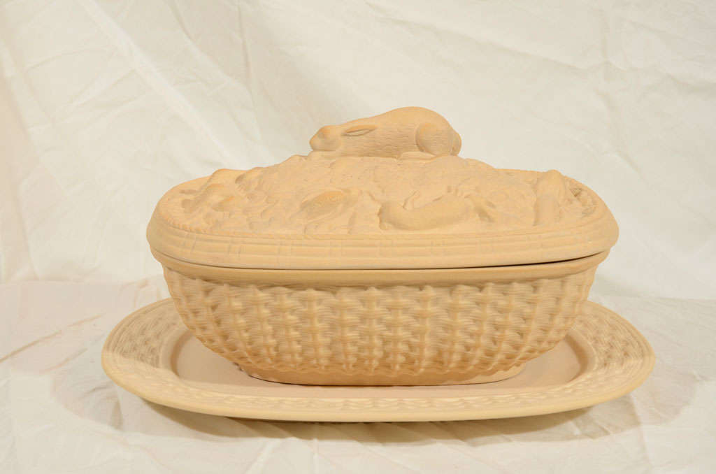 Caneware is an unglazed stoneware. In the late 1780's Wedgwood created the first Caneware game pie dishes with ornamental covers. Like this one Wedgwood's game pie dishes often had raised bas-relief ornaments of game and vine leaves, and a finial