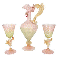 A Venetian Glass dragon pitcher with two matching goblets.