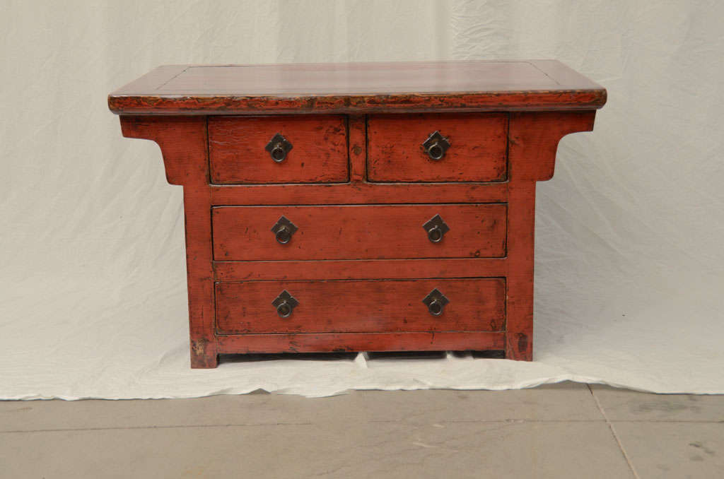 Mid-late 19th century Q'ing Dynasty red lacquered four-drawer Kang cabinet.